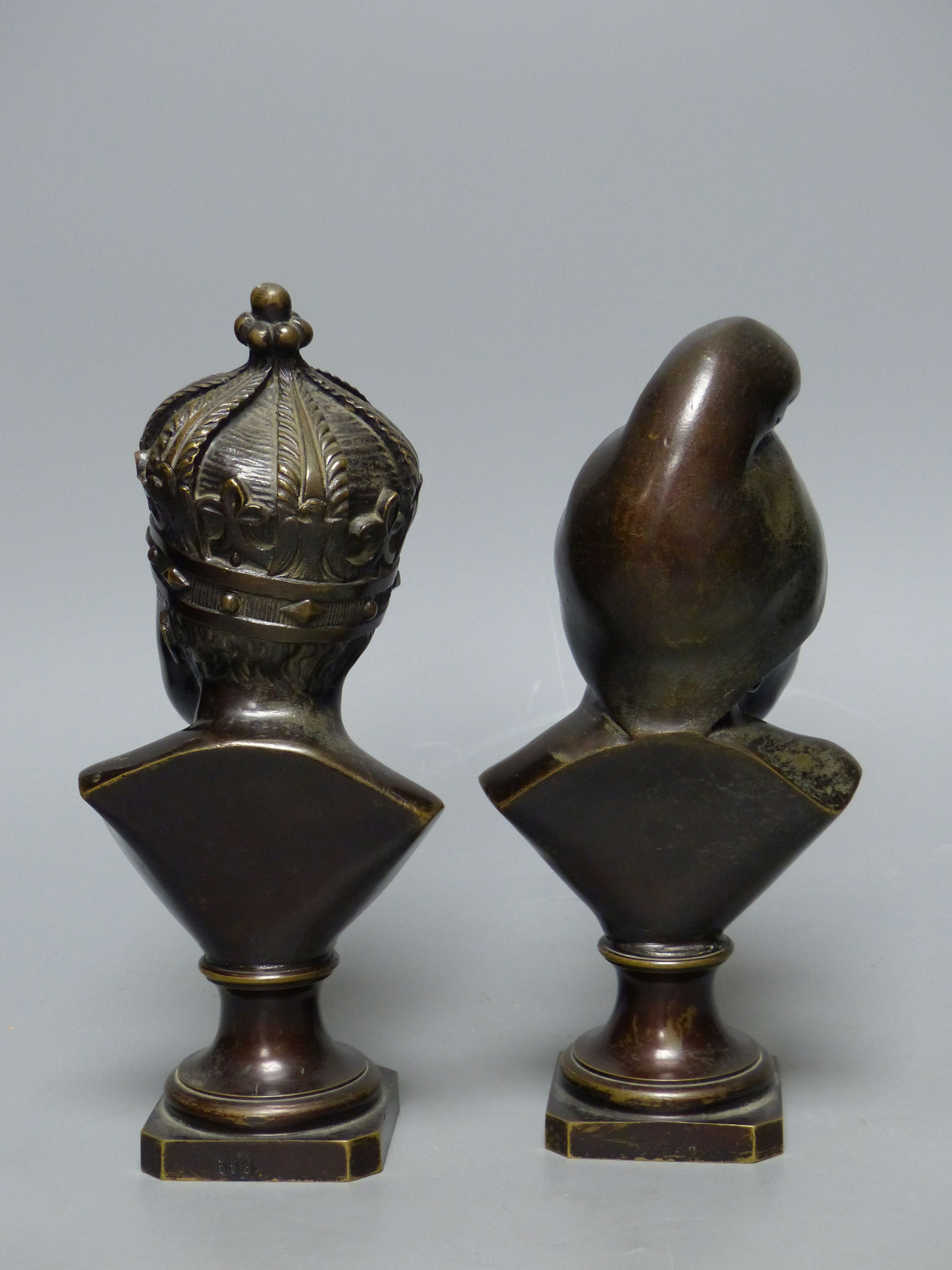 A small bronze bust of a child wearing a crown and another small bronze bust of a child, tallest 22cm H 22cm